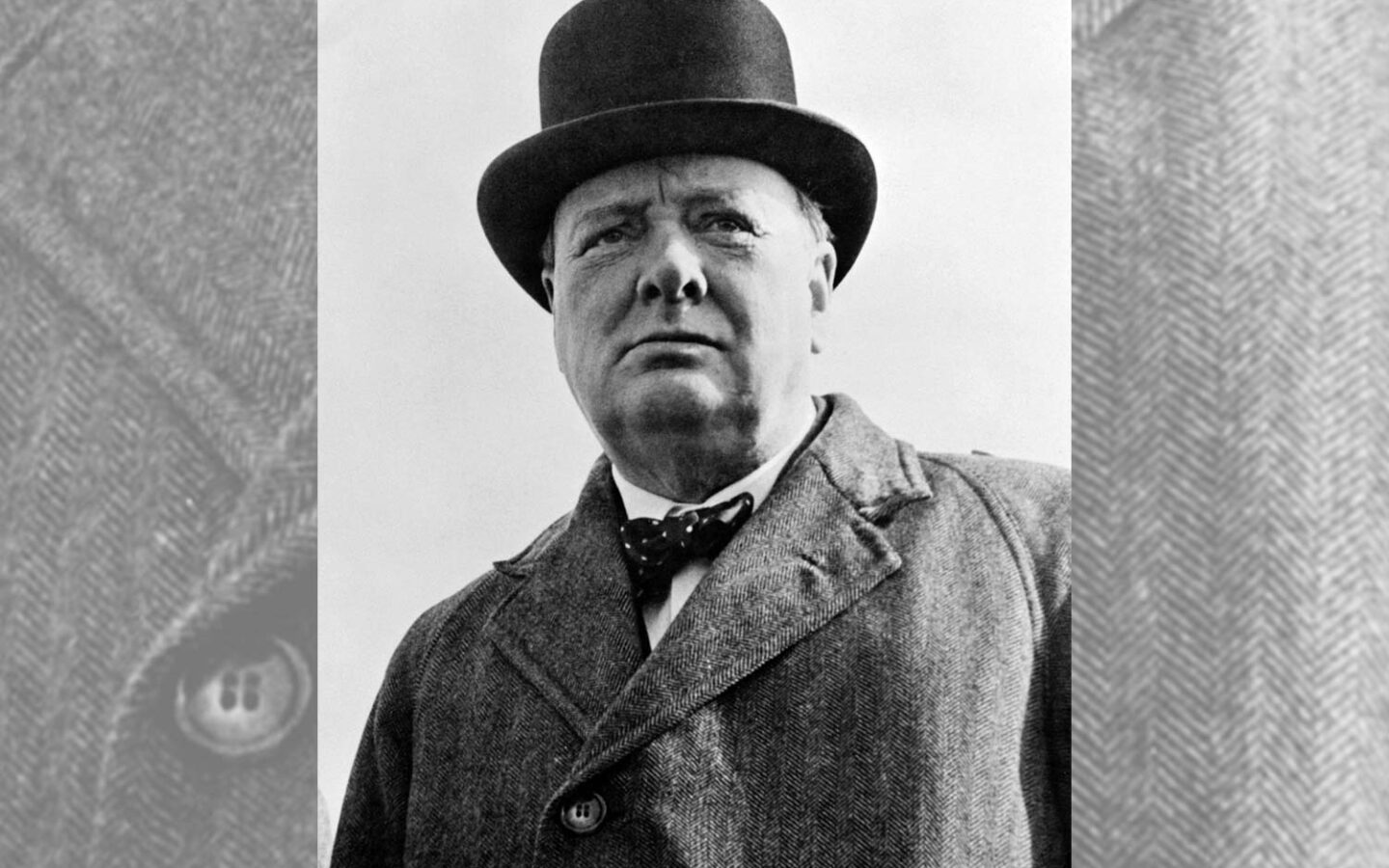 historical black and white photo of a man in a top hat