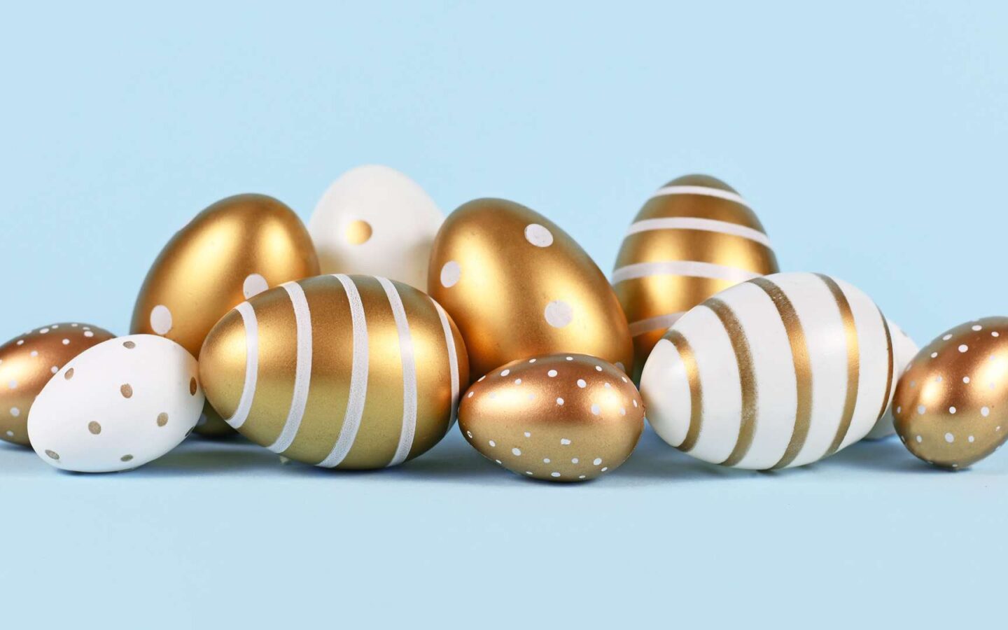 eggs painted with various gold and white patterns