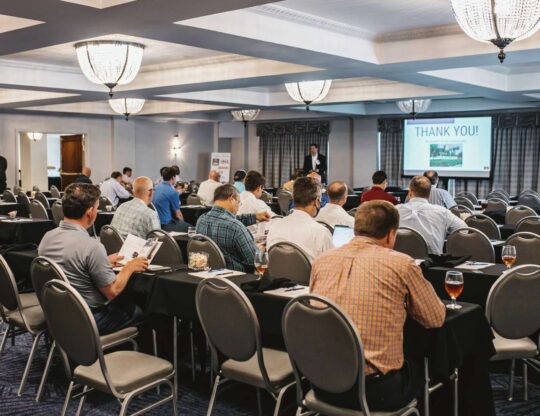 a group of people sitting at tables in a room