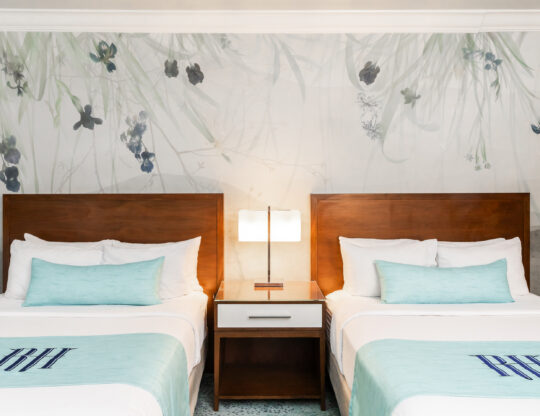 a hotel room with two beds