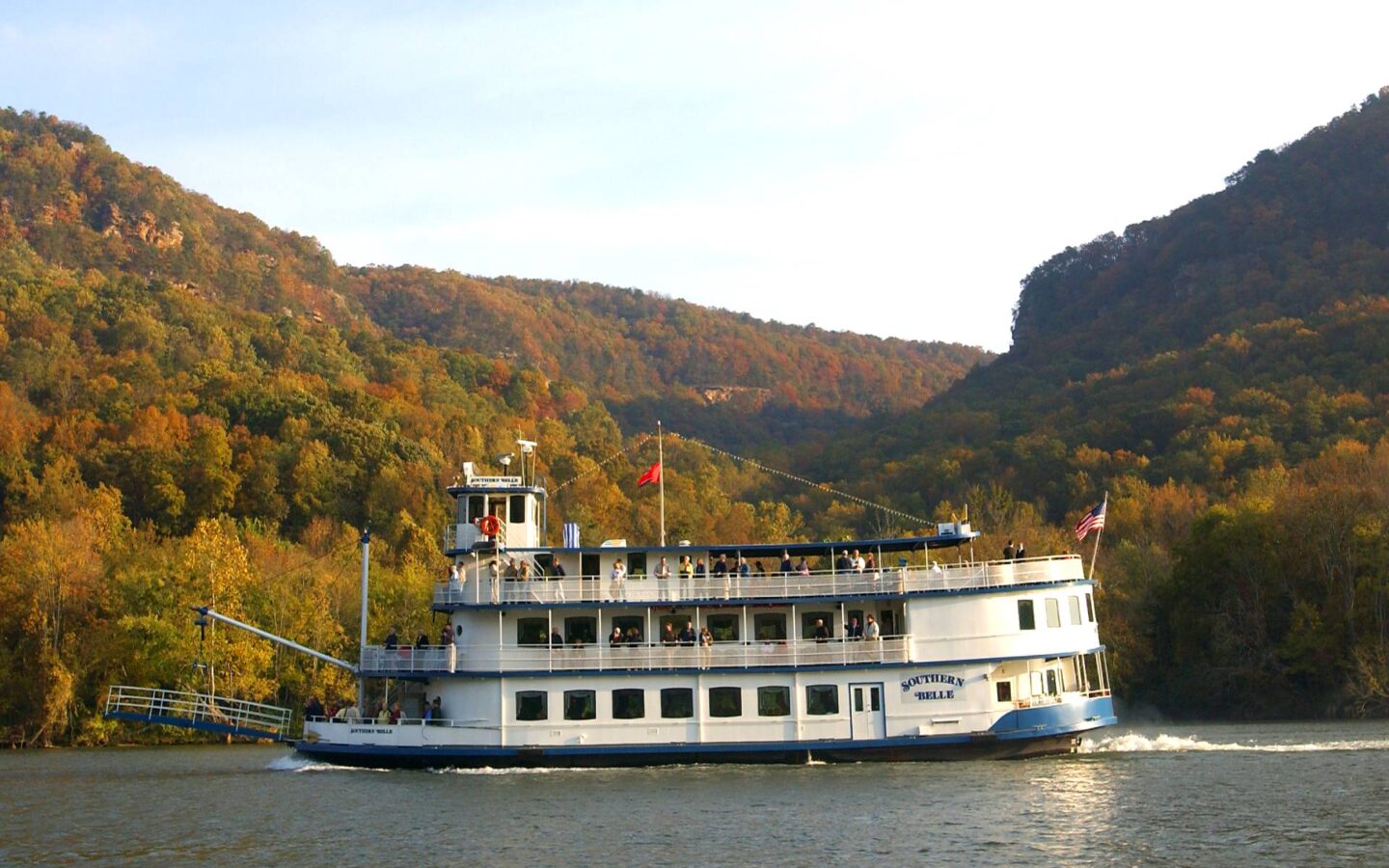 a riverboat travelling along a river